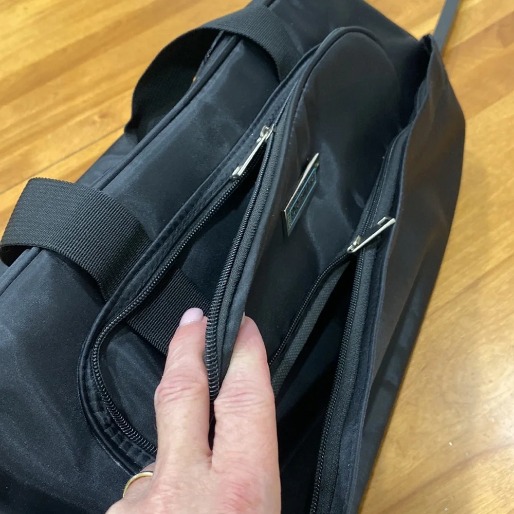 NWOT. Nylon rolling carry-on bag.